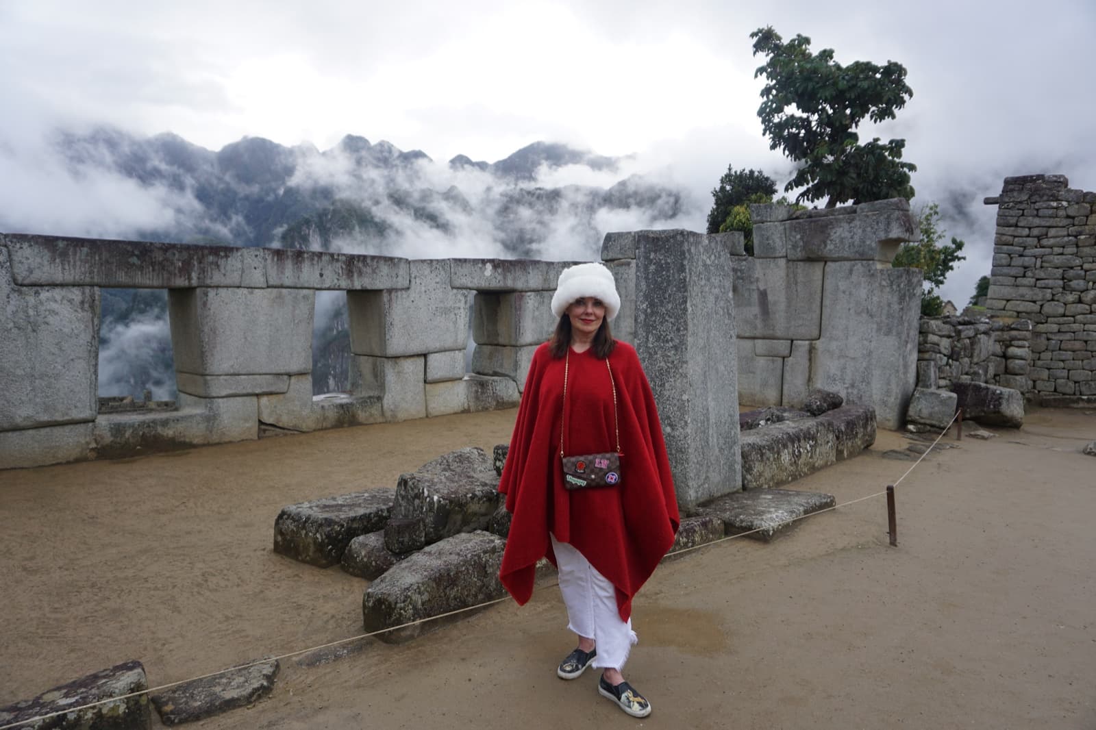 Donna among the Inca stone walls at Machu Picchu